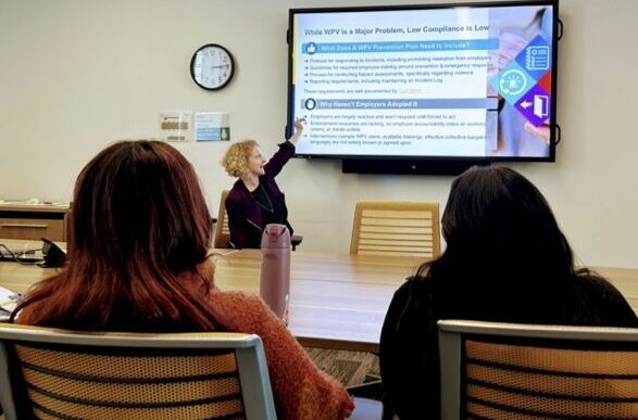 case study action shot ashley kochans points to a case study presentation on a screen